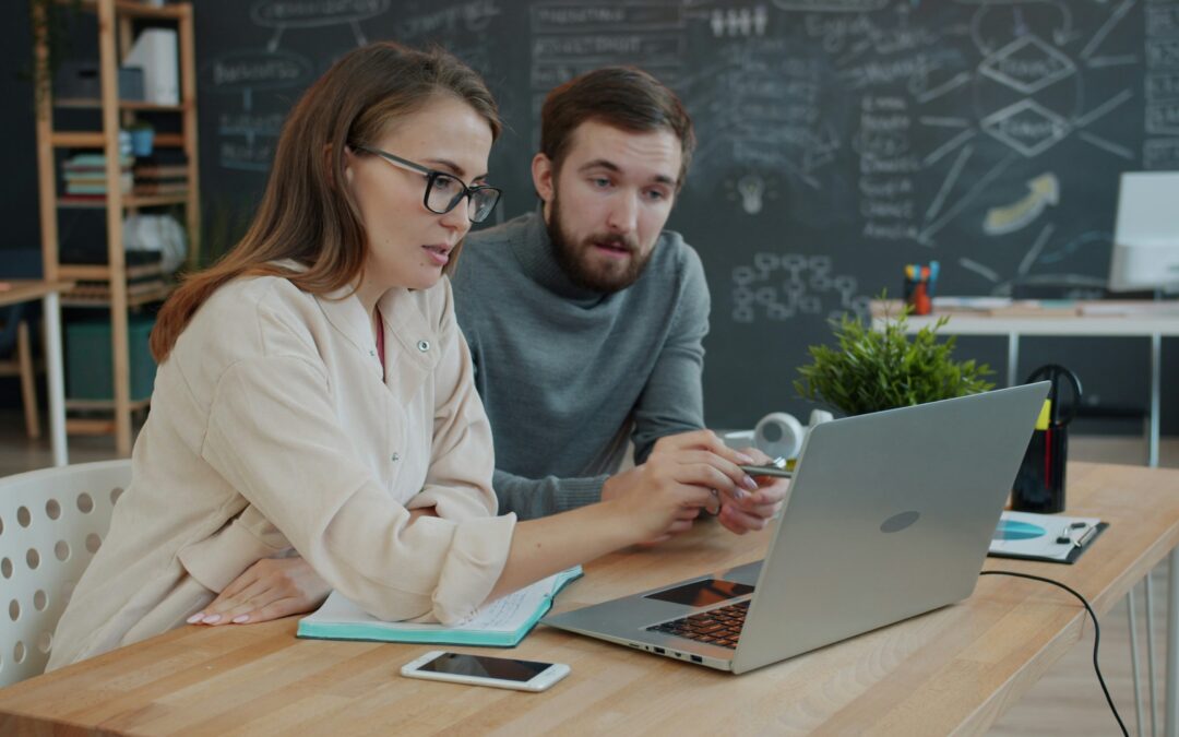 a 35 - 40 year old couple looking at their finances in June for a mid-year check-in remotely with their fiduciary